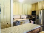 Fully stocked kitchen with all stainless steel appliances 